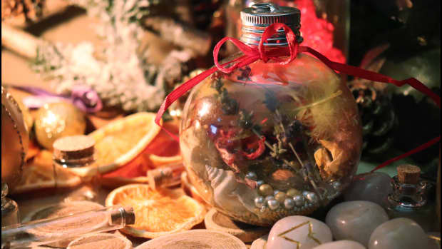 Witch ball ornament filled with magical ingredients.