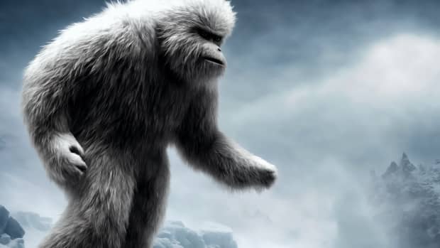A yeti on a snowy outcropping.