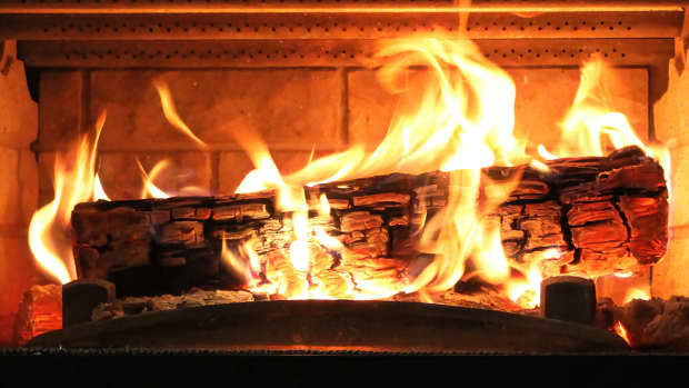 Closeup of a log burning in a fireplace.