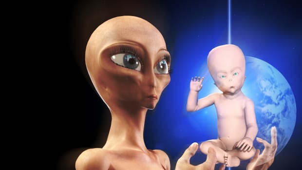 Alien holding a half human baby with a holographic projection of Earth in the background.