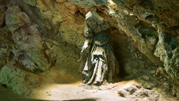 A stone figure of the witch "Mother Shipton" stands inside the cave of petrifying waters which bears her name