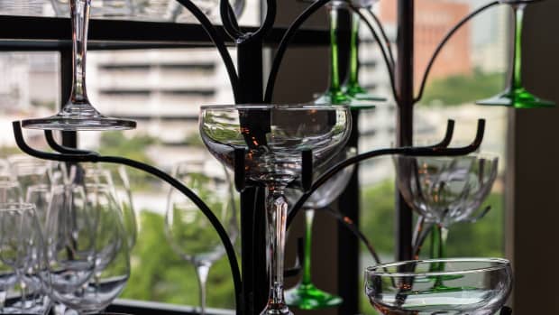 stemmed glasses in a wrought iron holder