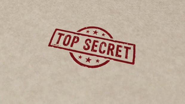 a top secret stamp on a file folder