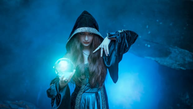 a witch with a magic glowing ball