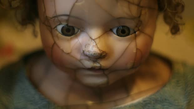a creepy broken doll's face