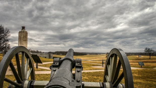 Cannon from the Battle of Gettysburg with intense clouds overhead.