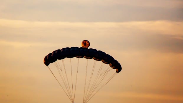 Parachuter silhouetted against the sky