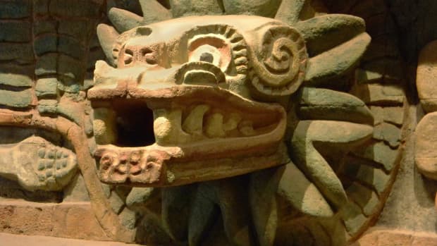 Stone carving of Quetzalcoatl, the Aztec feathered serpent god.