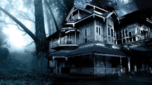 Creepy old house in a dark shadowy forest.