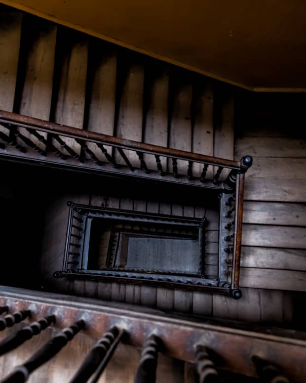 A shot looking down a creepy dark stairwell from above.
