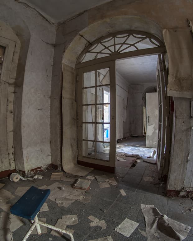 The ruined interior of an abandoned mansion