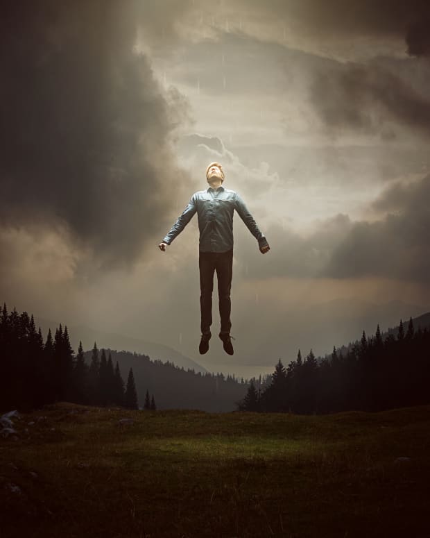 A man rises in the air above a stark landscape (Vecna-style)