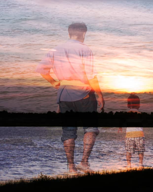 a double exposure of a man walking with a child set against a beachy sunset.