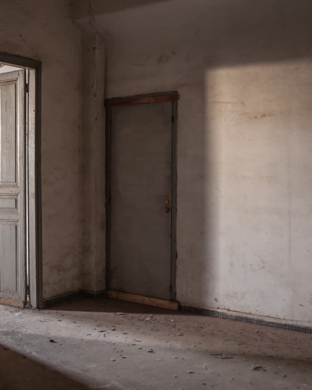 A door is partially open in a creepy abandoned House