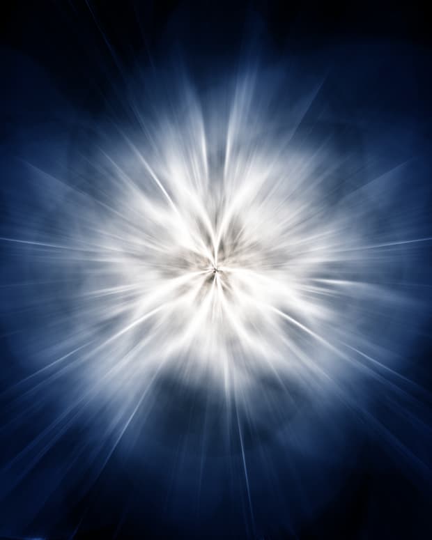 A sparkly white vortex against a dark blue background