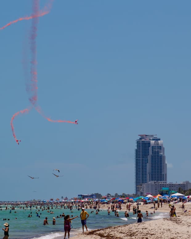 skydivers at the Miami air show over the beach