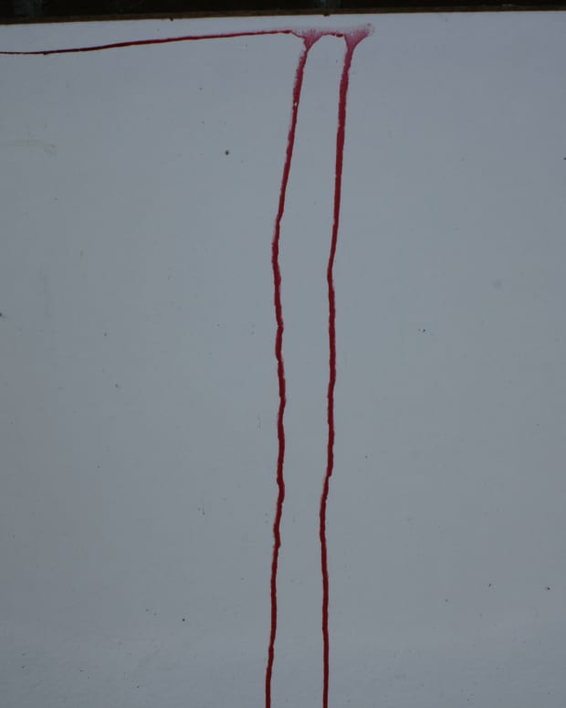 blood dripping down a white surface