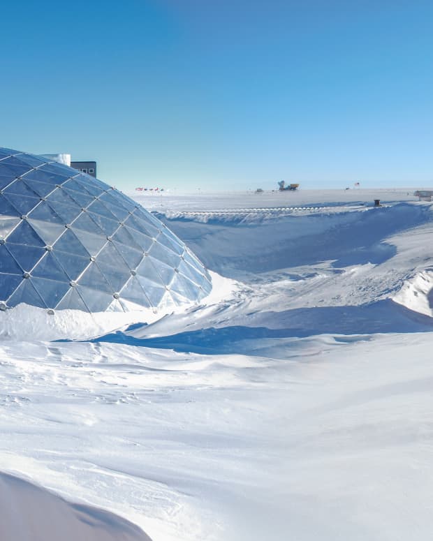 a domed building under snow at the South Pole