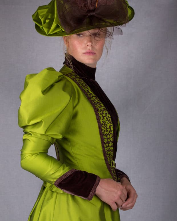 woman in a bright green Victorian dress