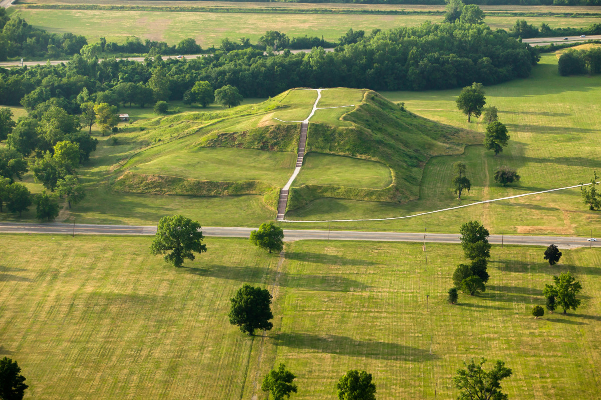 an aerial shot of a mound in Cahokia, an ancient human mound city in the midwest of the U.S.